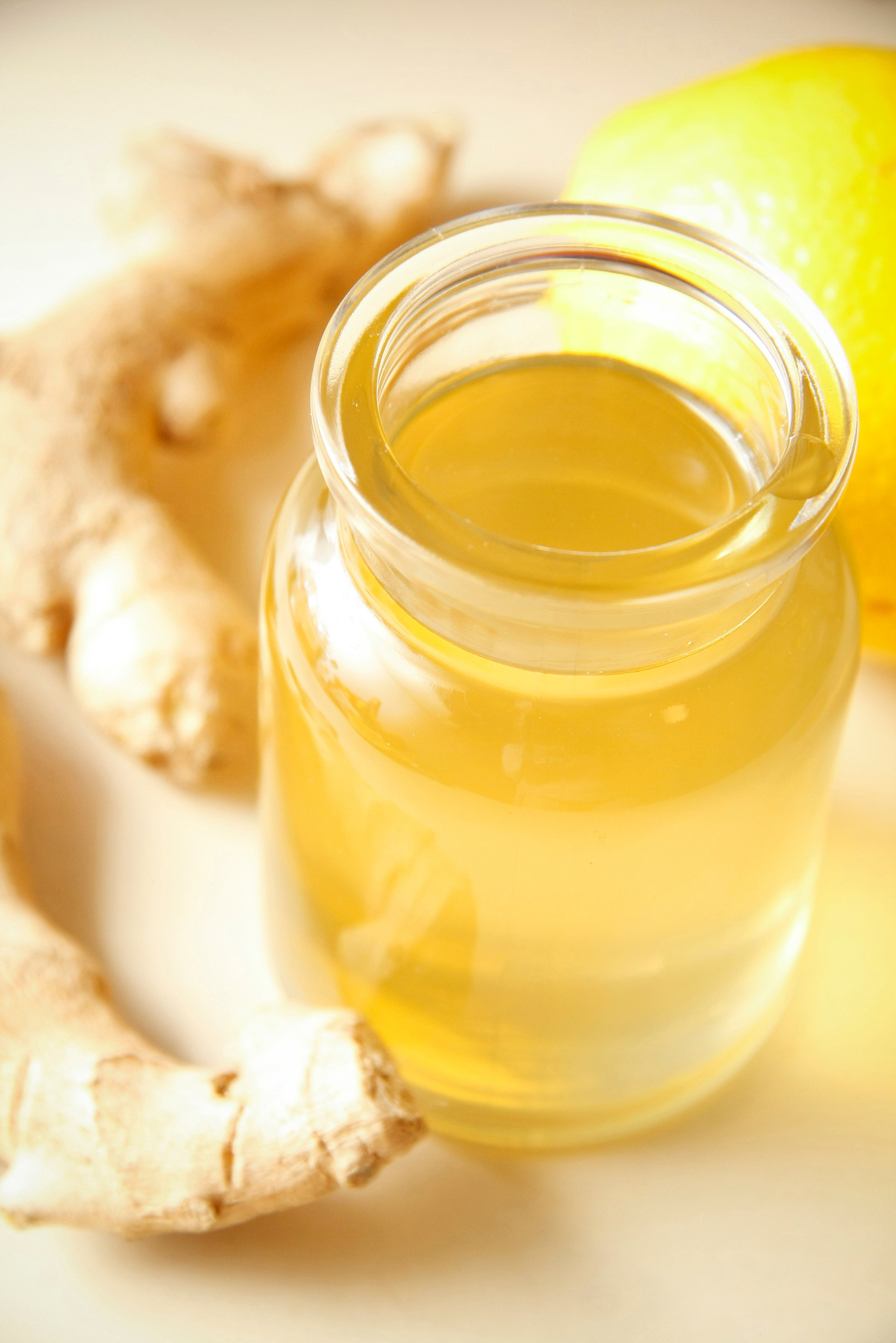 Ginger syrup with orange in glass bottle
